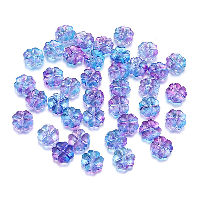 Al por mayor de 50 piezas/paquete de vidrio de color transparente de color trébol de cuatro hojas